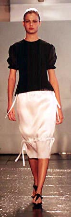 Luciane in a grey flocked puff sleeve top and silk satin organdy drawstring skirt