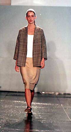 Angie in tartan check cotton/silk painter's jacket, white cotton pique tank and camel silk/mohair apron skirt